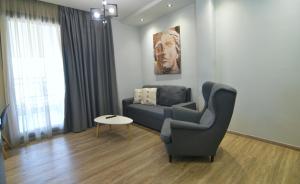 a living room with a couch and a table at Feel Athens Studios at Monastiraki in Athens