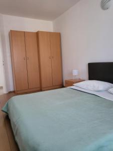 Postel nebo postele na pokoji v ubytování Apartments Matej & Irena