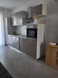 Kuchyň nebo kuchyňský kout v ubytování Apartments Matej & Irena