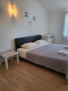 Postel nebo postele na pokoji v ubytování Apartments Matej & Irena