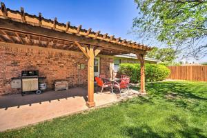 a pergola with a table and chairs in a yard at Unique Ranch-Style Home Less Than 2 Mi to Downtown! in Canyon