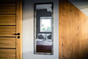 Posteľ alebo postele v izbe v ubytovaní CHILL HAUS APARTAMENTY , Domki