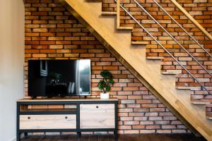 Kuchyňa alebo kuchynka v ubytovaní CHILL HAUS APARTAMENTY , Domki