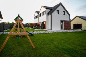 Detský kútik v ubytovaní CHILL HAUS APARTAMENTY , Domki