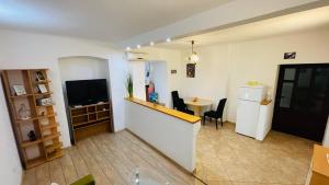 Televízia a/alebo spoločenská miestnosť v ubytovaní Apartment Dreamy