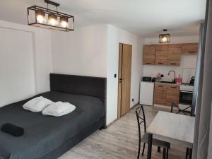 Pokoje i apartamenty MatDar客房内的一张或多张床位