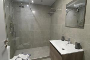 a bathroom with a shower and a sink and a toilet at Feel Athens Studios at Monastiraki in Athens