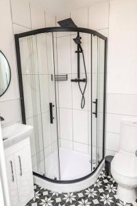 a bathroom with a shower and a toilet at * POPULAR * Stunning quiet apartment by the sea in Torquay