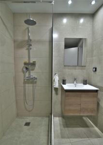 a bathroom with a shower and a sink at Feel Athens Studios at Monastiraki in Athens