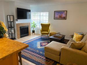 a living room with a couch and a fireplace at Catalina Condo @ LaEncantada - Tucson AZ in Tucson
