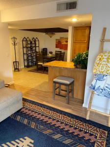 a living room with a counter and a table at Catalina Condo @ LaEncantada - Tucson AZ in Tucson