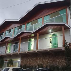 a large building with a lot of windows at Pousada Serrano in Campos do Jordão