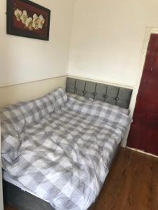 a bed in a corner of a room at Sky city hotel in Blackpool