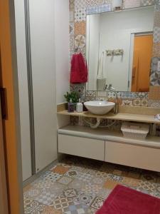 a bathroom with a sink and a mirror at Solar Flats - WooD - Pipa RN in Pipa