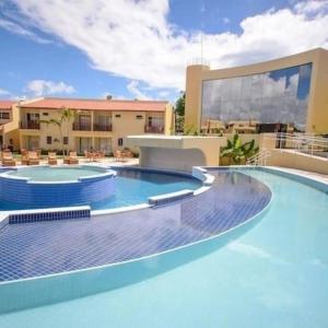 a large swimming pool in front of a building at Solar Flats - WooD - Pipa RN in Pipa