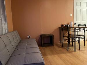 a living room with a couch and a table at Cabañas Caur in San Pedro de Atacama