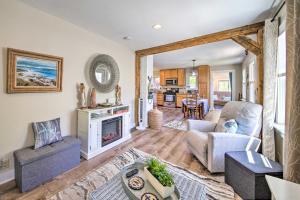 a living room with a couch and a fireplace at Charming East Boothbay Cottage with Large Yard! in East Boothbay