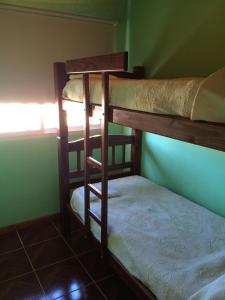 two bunk beds in a room with a window at Ciudad de las Colinas in Victoria