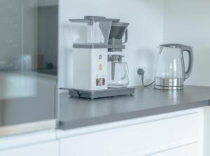 a kitchen counter with a blender on top of it at New / Stunning Sea View / Light / 3 BR in Tórshavn +13 photos