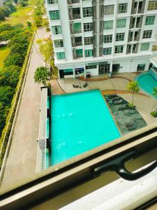 a pair of scissors sitting on top of a swimming pool at Peace home in Cyberjaya