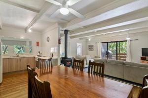 a living room with a table and a couch at Beechworth Holiday Park in Beechworth