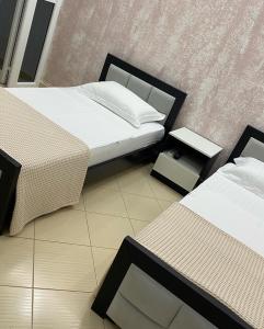 מיטה או מיטות בחדר ב-Hotel Beach Restaurant Fabio