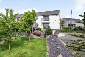 a house with a garden in front of it at Gorwel Deg in Bangor