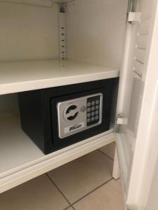 a microwave oven in a cabinet in a kitchen at Room in BB - Casa Belvedere - complimentary Wifi and private parking in Veneto