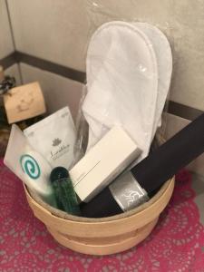 a basket filled with bathroom items on a table at Room in BB - Casa Belvedere - complimentary Wifi and private parking in Veneto