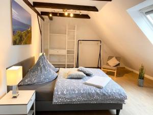 a bedroom with a bed in a attic at Gut Koselau Landhaus III 