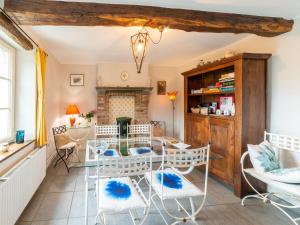 a dining room with a table and chairs at Charming Cottage in Anseremme with Fenced Garden in Dinant
