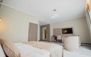 TV a/nebo společenská místnost v ubytování Mineral SPA Draugystė