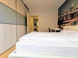 Postel nebo postele na pokoji v ubytování Scandian Apartments - City Hub Tallinn