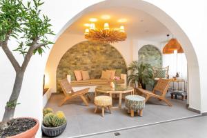 a living room with a table and chairs at MARE MARIN BOUTIQUE HOTEL in Bodrum City