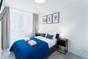 Ein Bett oder Betten in einem Zimmer der Unterkunft Apartamenty Adyl Platany