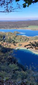 an aerial view of a large body of water at Gîte chez Marianne- la halte Jurassienne in Montmorot +4 photos
