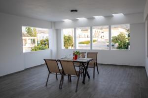a dining room with a table and chairs at On The Breeze 1 in Kos