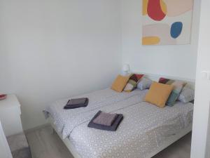 a bedroom with a bed with pillows on it at Holiday House Romi in Pula