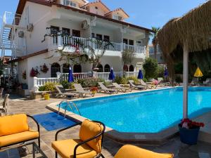 a swimming pool in front of a hotel at Casablanca Hotel in Dalyan