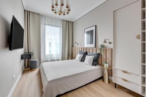 Posteľ alebo postele v izbe v ubytovaní Grand Apartments - Brabank Premium apartament w centrum Gdańska