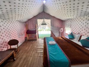 a bedroom with a bed in a tent at North Deodar Camps in Kasol