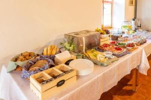 a table with a buffet of food on it at Althanský hostinec in Znojmo