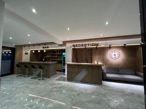 a lobby of a hotel with a reception desk at Didim Elit Otel in Didim