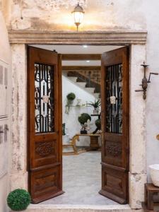 an entrance to a house with a wooden door at History House Moja Ti 1830 in Old Town Senj in Senj