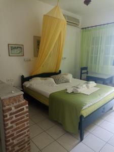Postel nebo postele na pokoji v ubytování Pagali Hotel