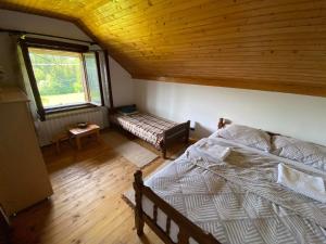 Ένα ή περισσότερα κρεβάτια σε δωμάτιο στο Mystic Forest Hostel