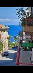 a view of a street with the ocean in the background at A me Casa in Gioiosa Marea