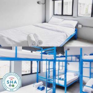 Loftel Station Hostel في بانكوك: صورتين لسرير بطابقين في غرفة