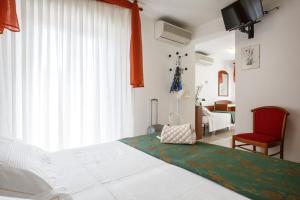 Cama o camas de una habitación en Hotel Ada