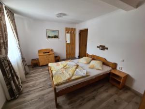 Postel nebo postele na pokoji v ubytování Sándor Panzió